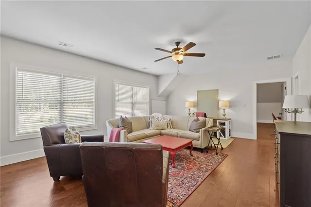 a living room with furniture and flat screen tv