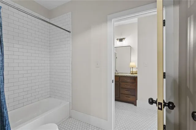 a living room with furniture fireplace and a window