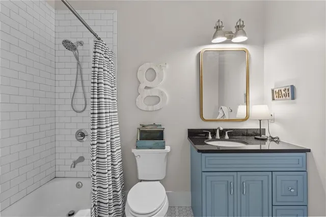 a dining room with furniture a rug and wooden floor