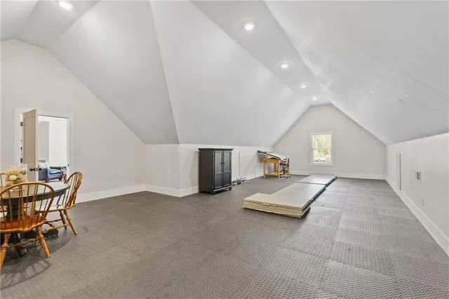 a living room with furniture tv and a large window