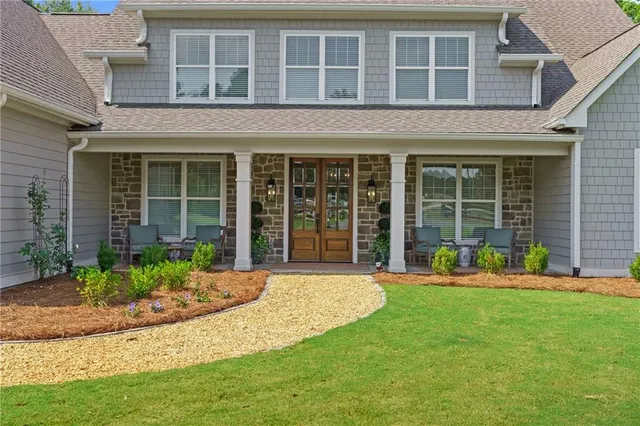 a view of a hallway view with wooden floor and staircase