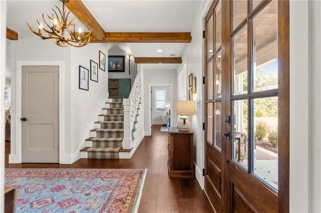 a view of a livingroom with furniture and hardwood floor