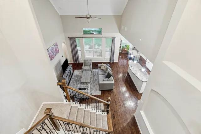 a view of a living room with furniture window and wooden floor