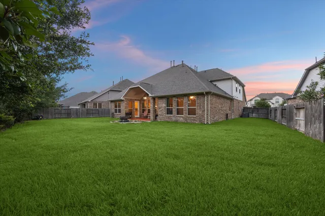 a view of a house with a big yard