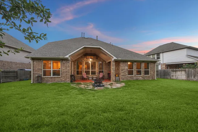 a front view of a house with a garden and porch