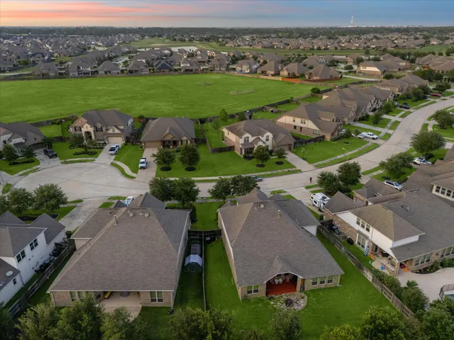 an aerial view of a house with outdoor space