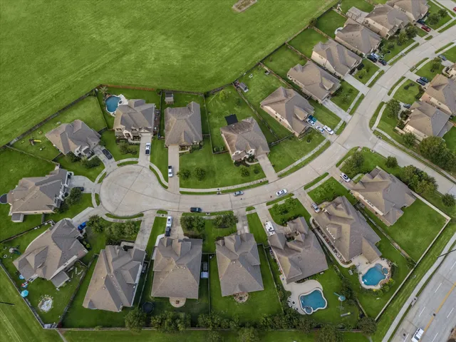 an aerial view of a house with outdoor space