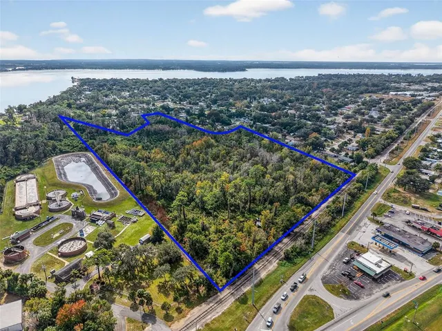 an aerial view of a residential houses with outdoor space
