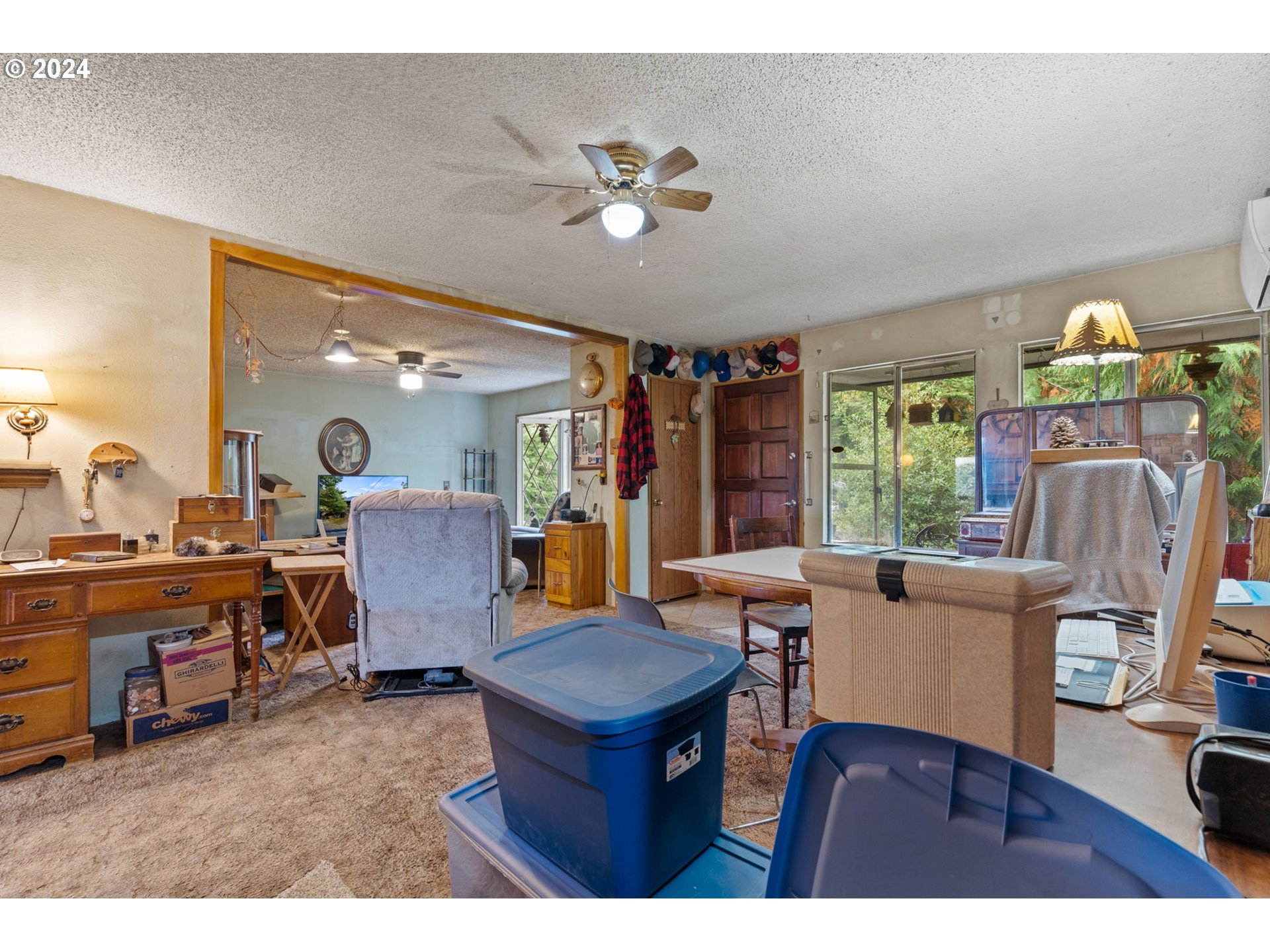 19733 South Harper Road Colton, OR 97017 - Photo 25 of 48 a living room with furniture a chandelier and a dining table