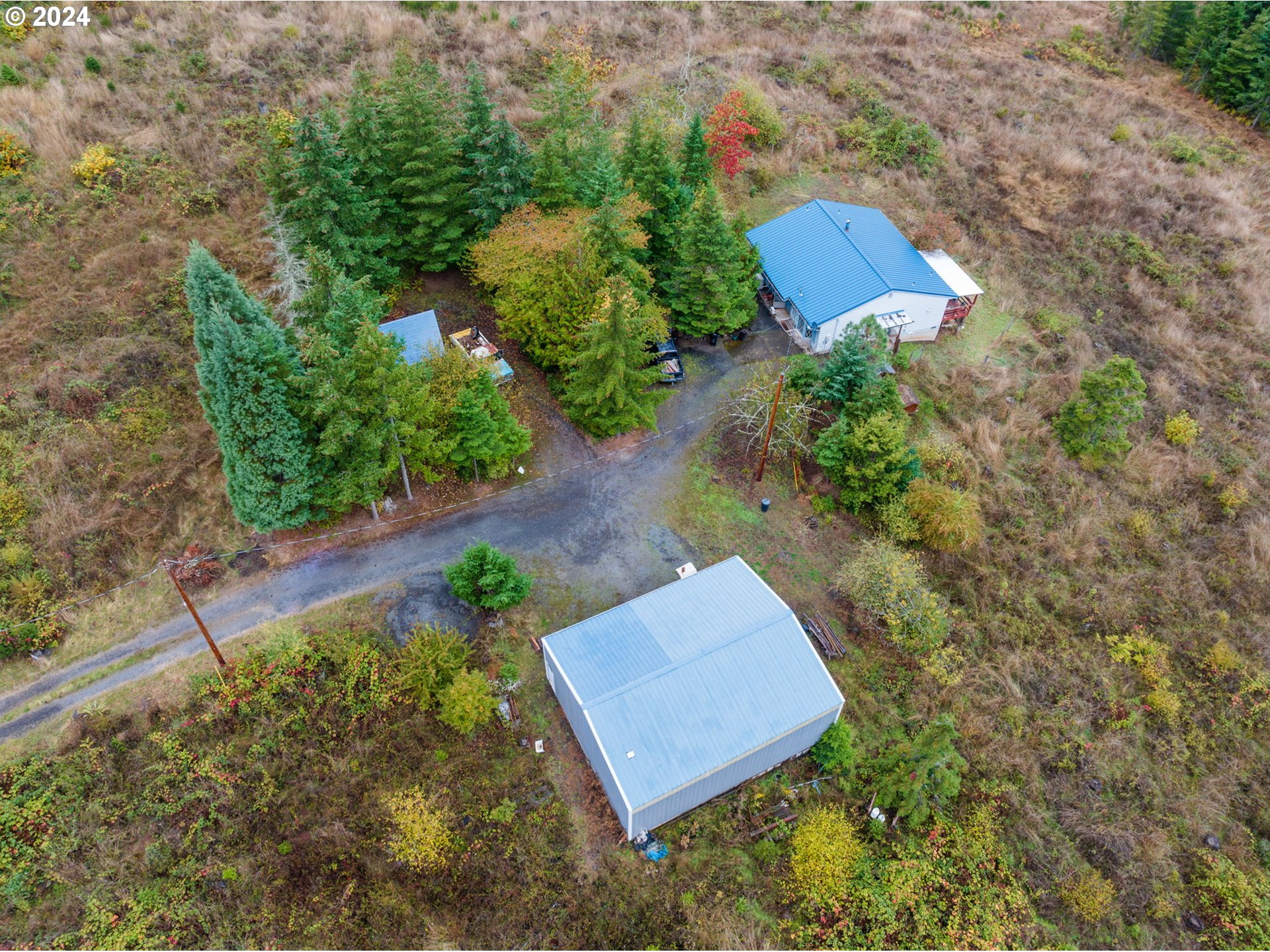 19733 South Harper Road Colton, OR 97017 - Photo 38 of 48 an aerial view of a house with a yard and trees