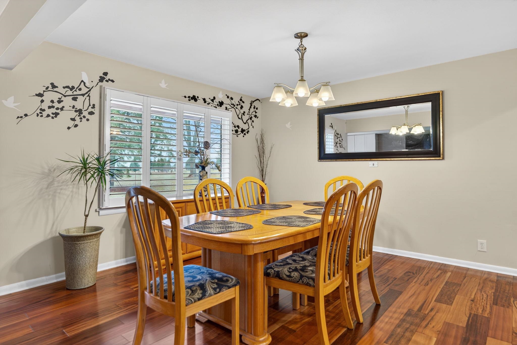 7681 Mill Road Rockford, IL 61108 - Photo 12 of 43 a view of a dining room with furniture window and wooden floor
