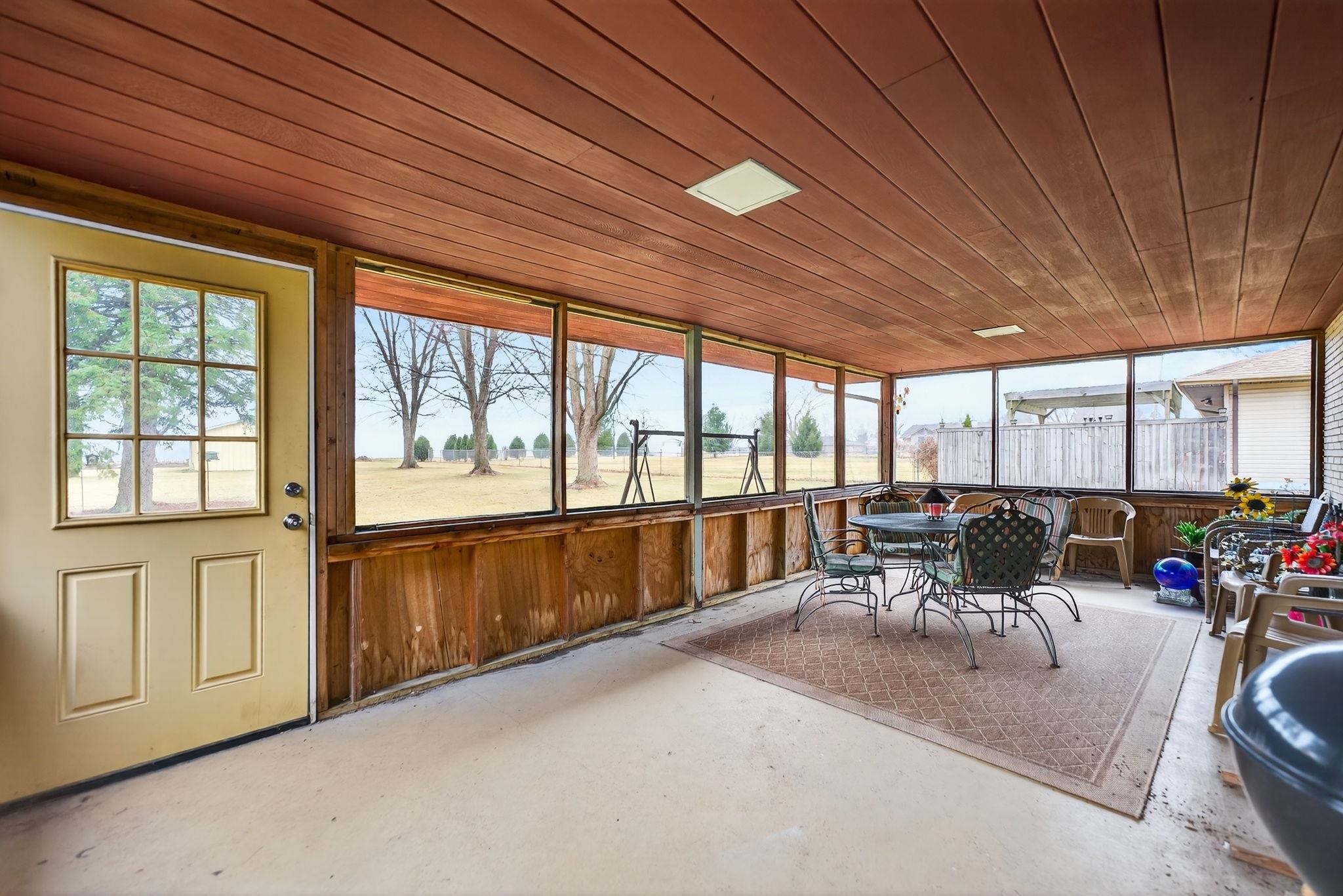 7681 Mill Road Rockford, IL 61108 - Photo 24 of 43 a living room with furniture and a large window