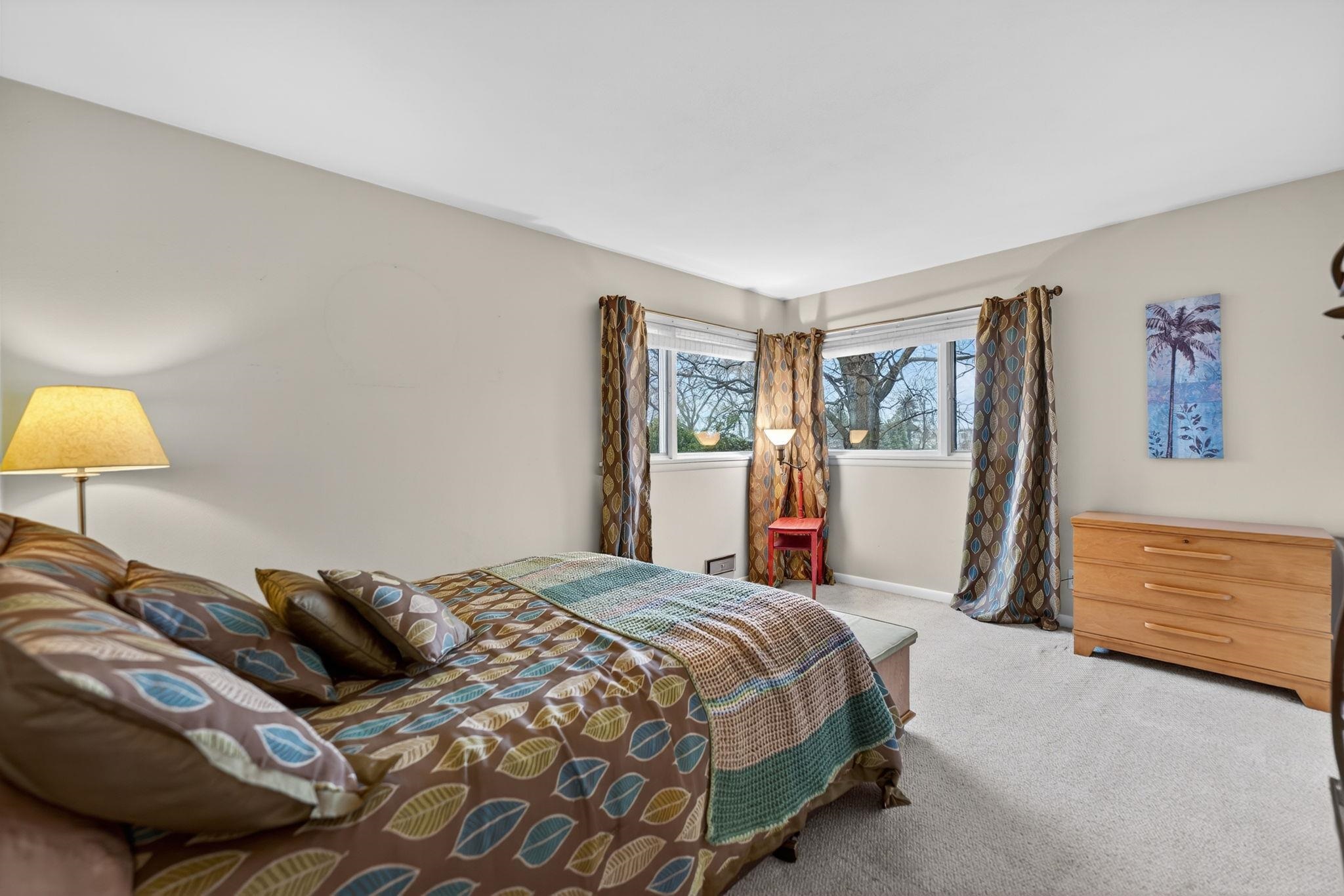 7681 Mill Road Rockford, IL 61108 - Photo 25 of 43 a bedroom with a bed and a lamp