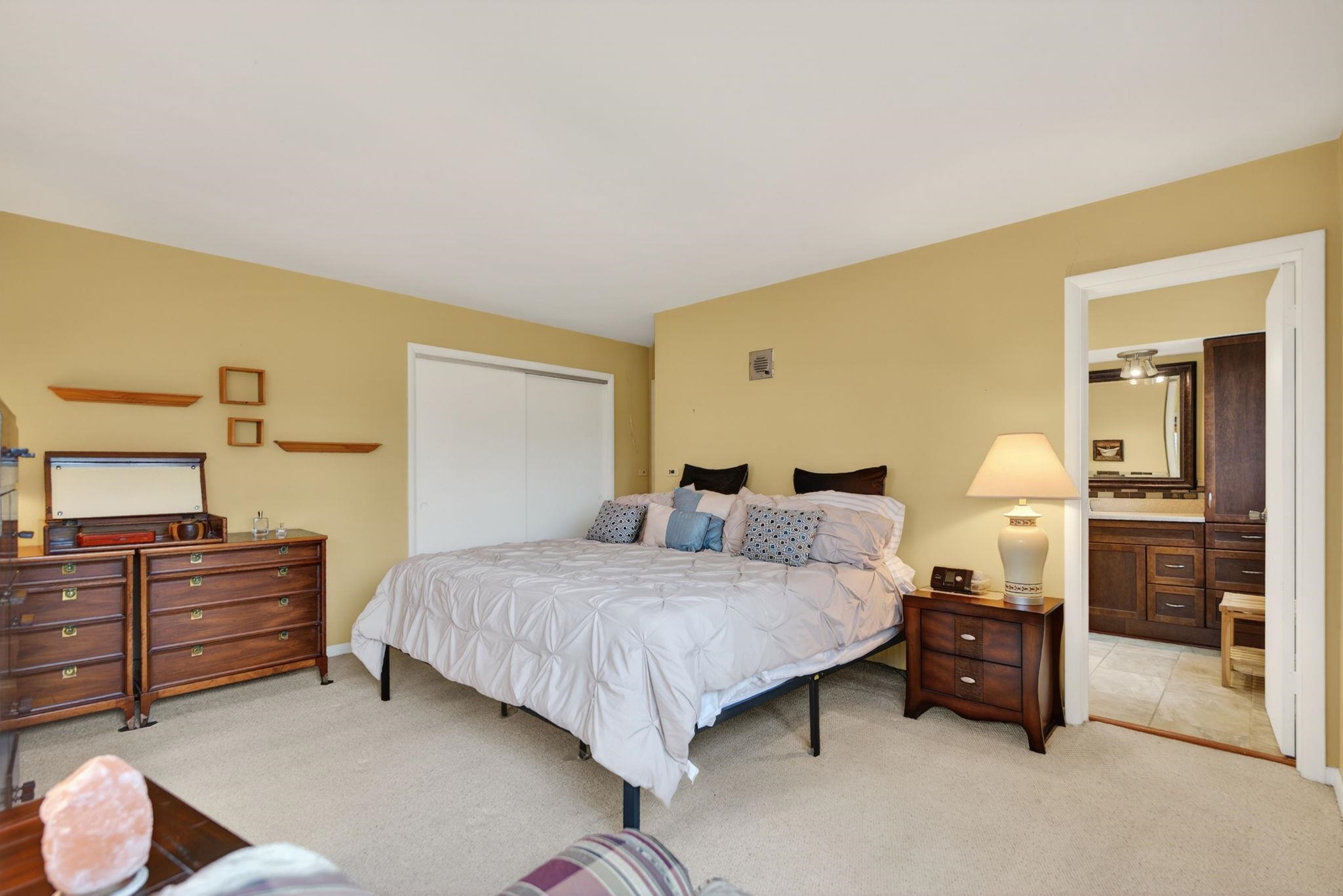 7681 Mill Road Rockford, IL 61108 - Photo 32 of 43 a bedroom with a bed and dresser with mirror