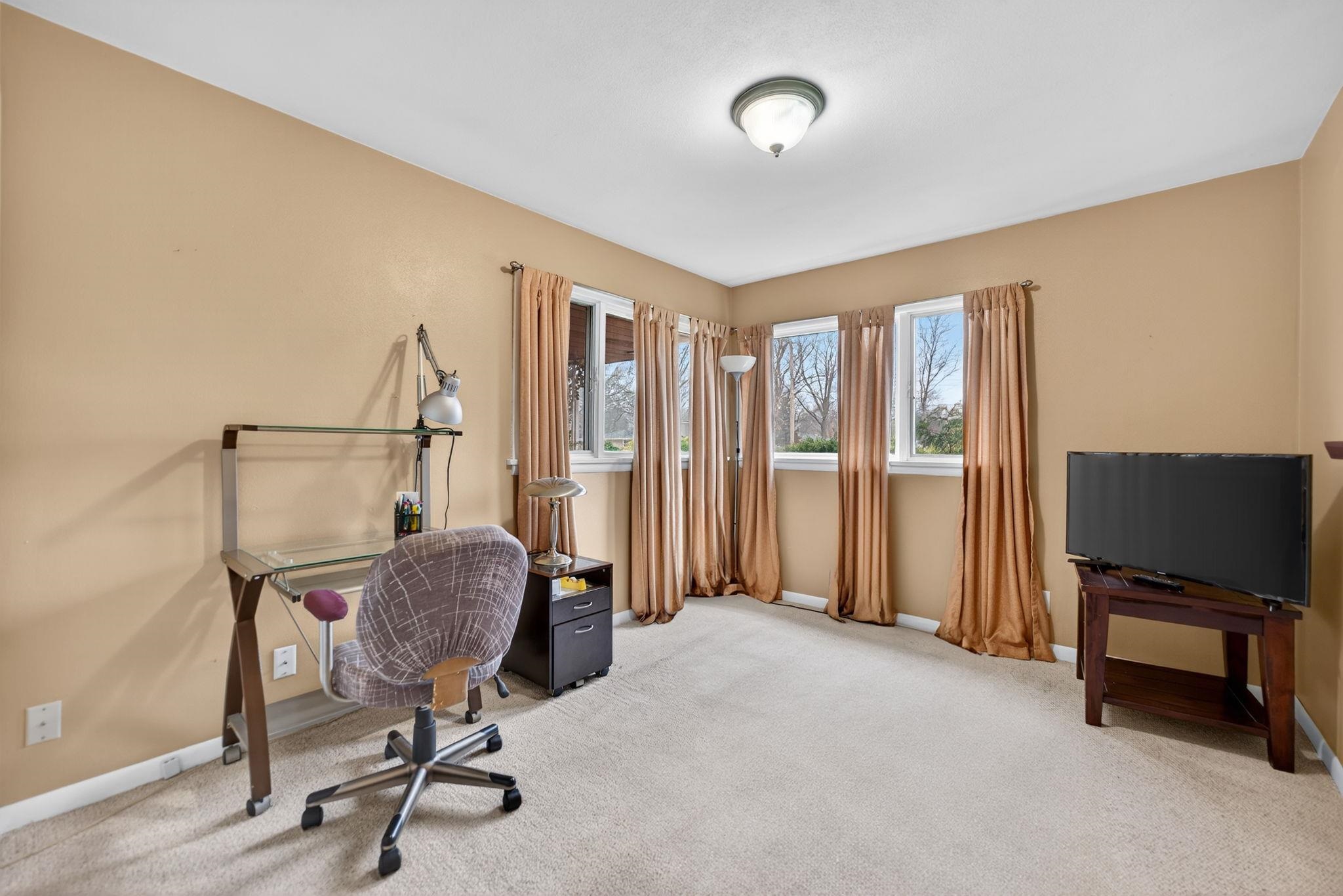 7681 Mill Road Rockford, IL 61108 - Photo 33 of 43 a view of a workspace with furniture and a window