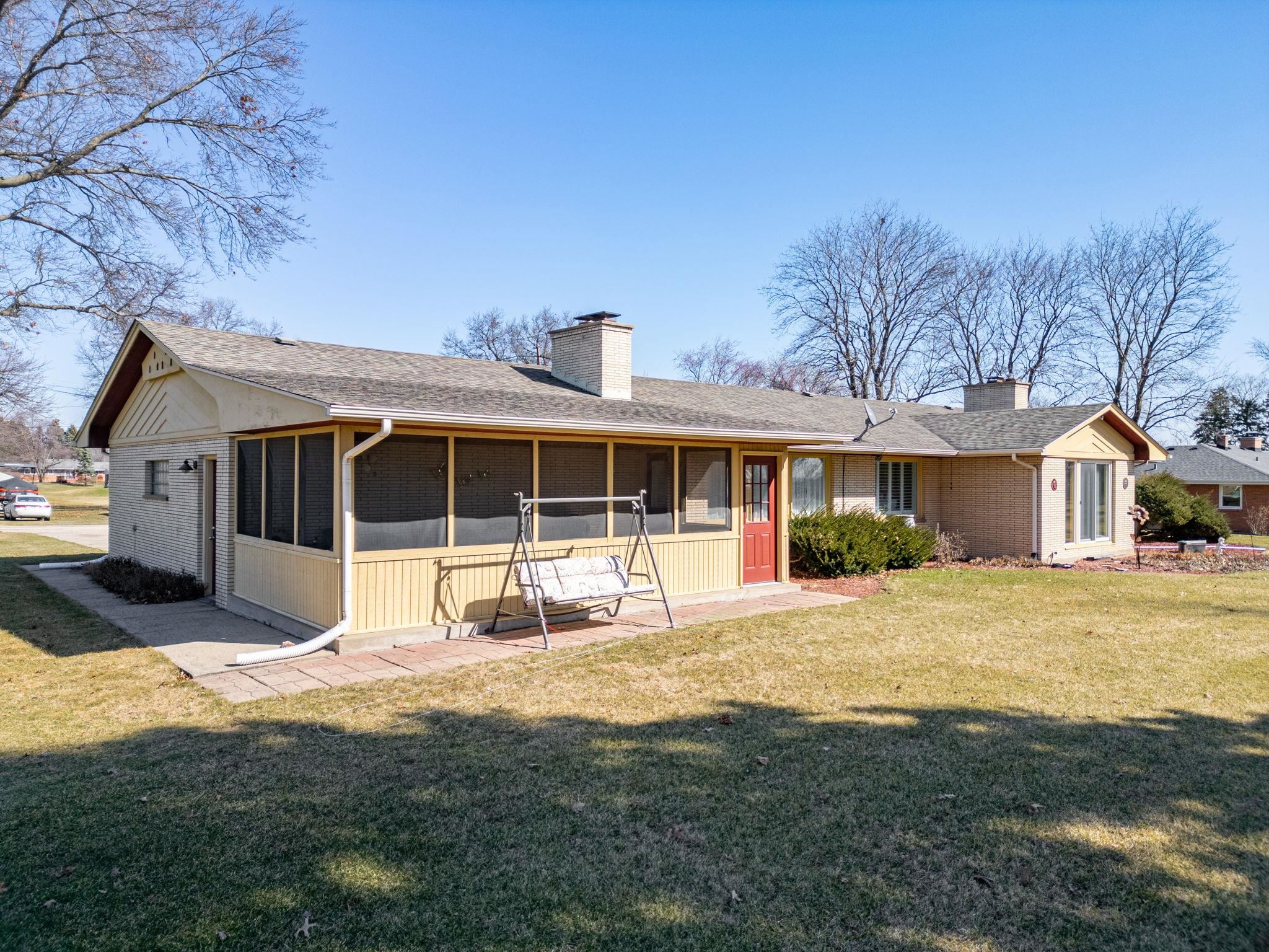 7681 Mill Road Rockford, IL 61108 - Photo 39 of 43 a house view with a sitting space and garden