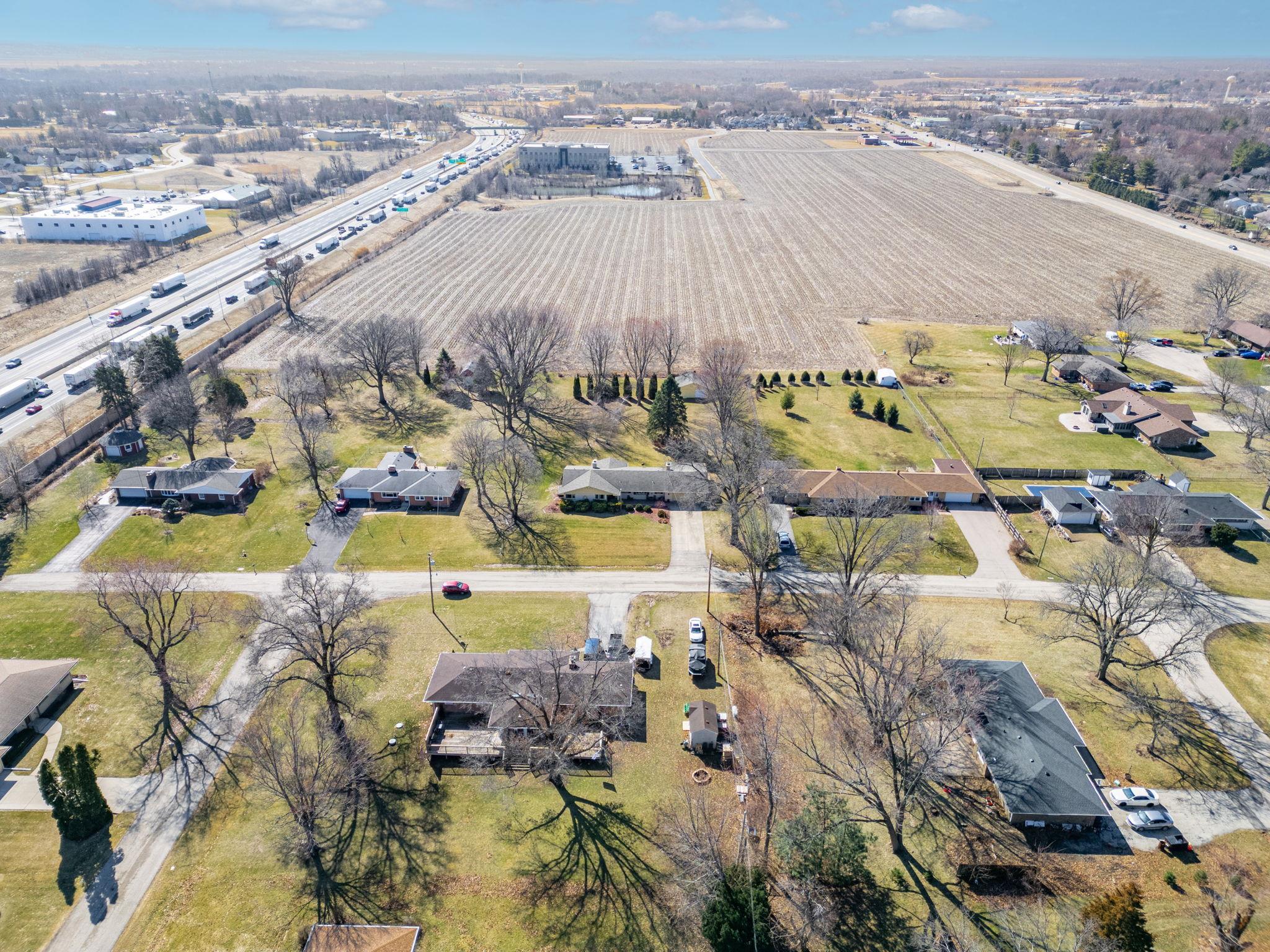 7681 Mill Road Rockford, IL 61108 - Photo 43 of 43 an aerial view of residential houses with outdoor space