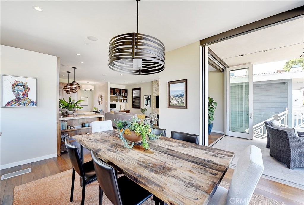 418 Carnation Avenue Corona del Mar, CA 92625 - Photo 12 of 29 a view of a dining room with furniture