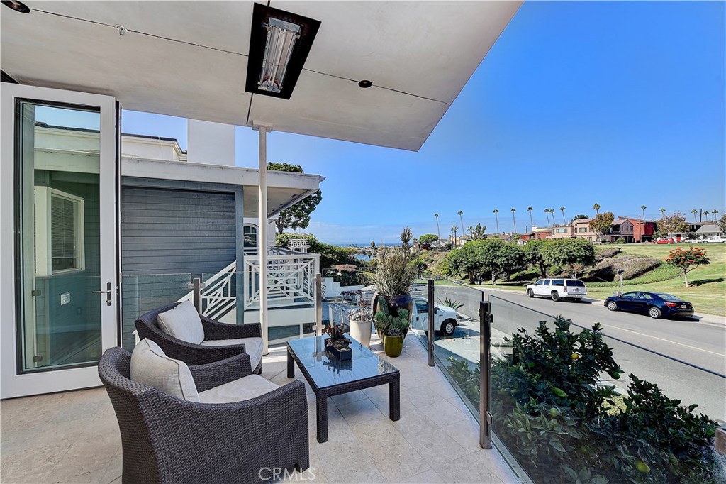 418 Carnation Avenue Corona del Mar, CA 92625 - Photo 13 of 29 a view of a terrace with furniture
