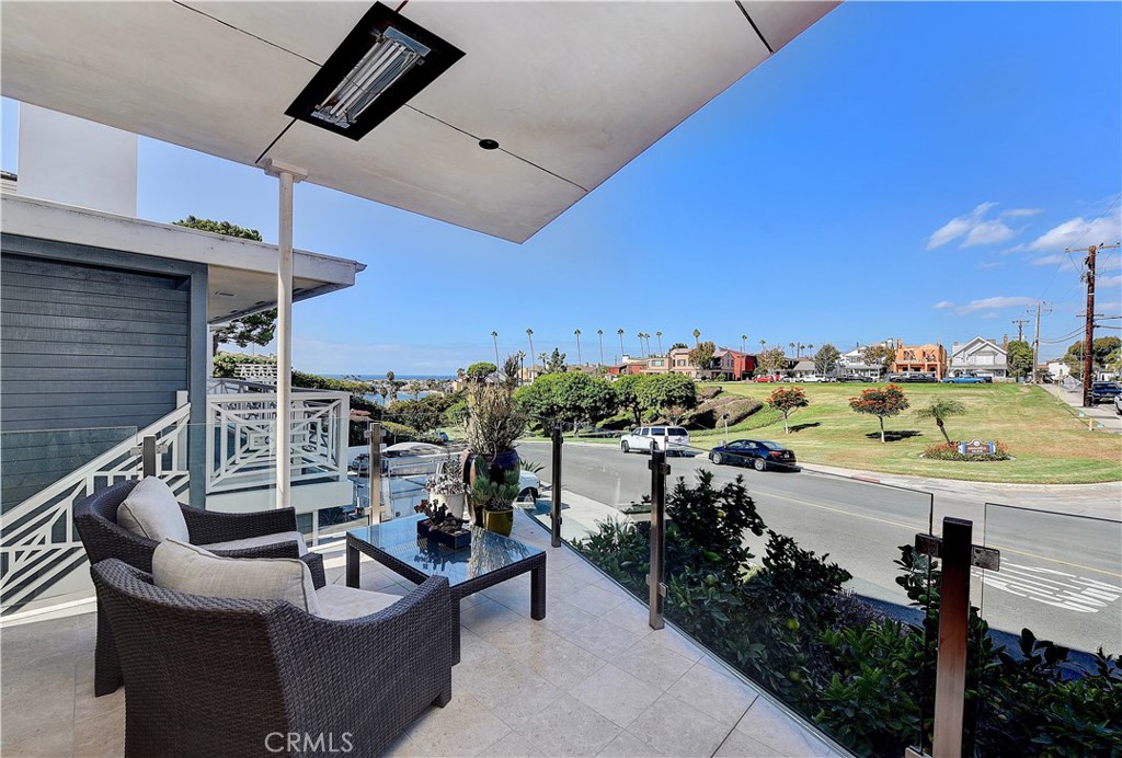418 Carnation Avenue Corona del Mar, CA 92625 - Photo 14 of 29 a view of a terrace with furniture and a fire pit