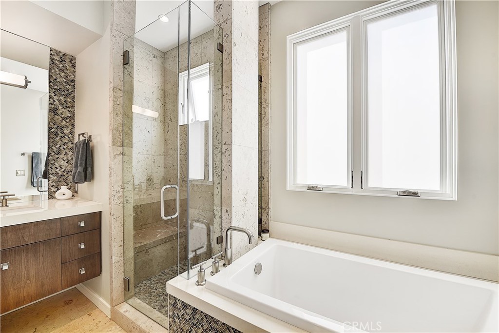 418 Carnation Avenue Corona del Mar, CA 92625 - Photo 17 of 29 a white bath tub sitting next to a shower