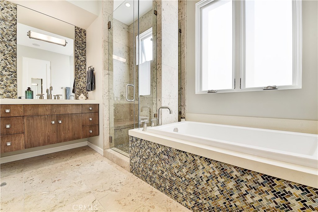 418 Carnation Avenue Corona del Mar, CA 92625 - Photo 18 of 29 a spacious bathroom with sink and mirror
