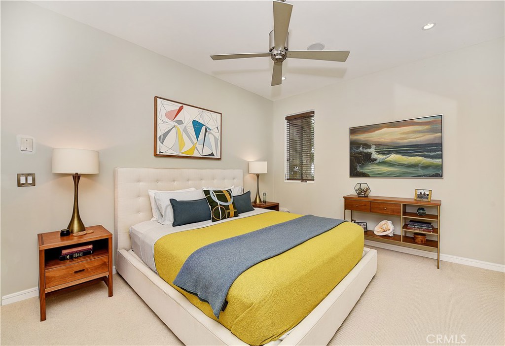 418 Carnation Avenue Corona del Mar, CA 92625 - Photo 23 of 29 a bedroom with a bed and a flat screen tv