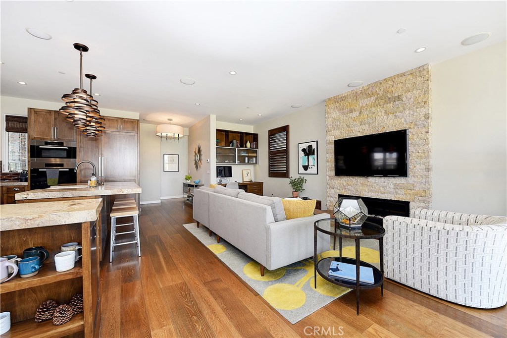418 Carnation Avenue Corona del Mar, CA 92625 - Photo 3 of 29 a living room with furniture and a flat screen tv
