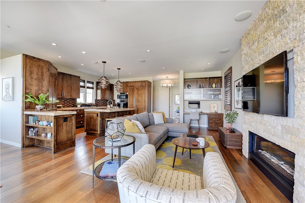 418 Carnation Avenue Corona del Mar, CA 92625 - Photo 5 of 29 a living room with fireplace furniture and a flat screen tv