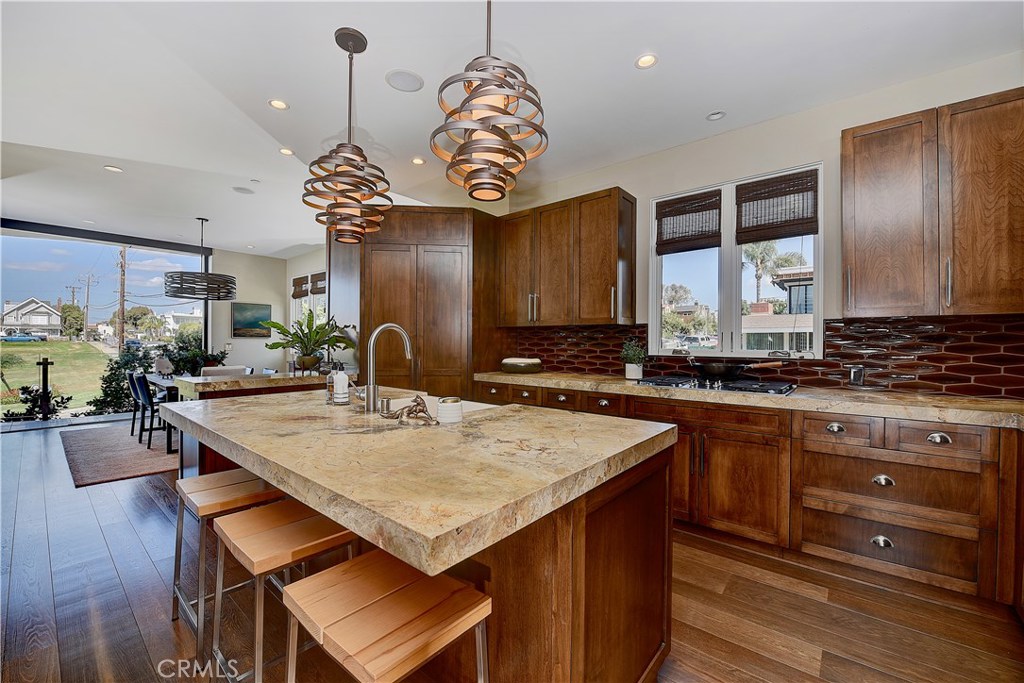 418 Carnation Avenue Corona del Mar, CA 92625 - Photo 8 of 29 a kitchen with a counter space cabinets and appliances