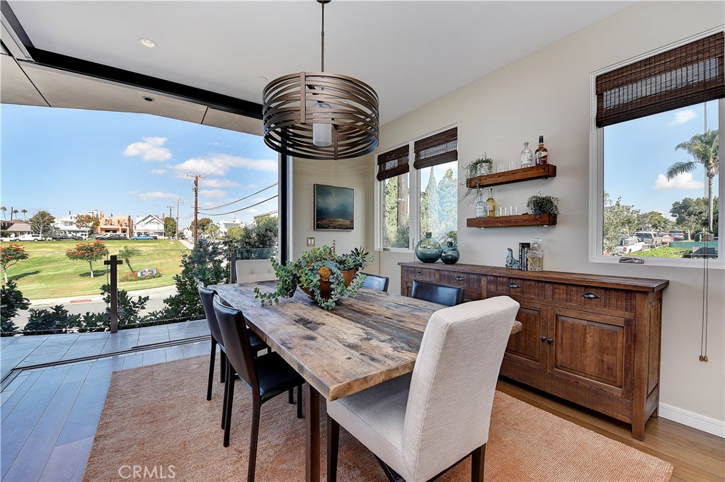 418 Carnation Avenue Corona del Mar, CA 92625 - Photo 10 of 29 a view of a dining room with furniture window and outside view