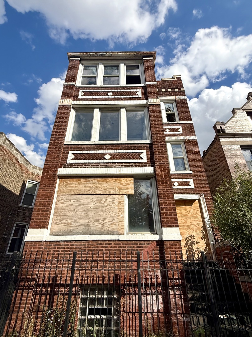 1839 South Springfield Avenue Chicago, IL 60623 - Photo 6 of 7 a front view of a multi story building