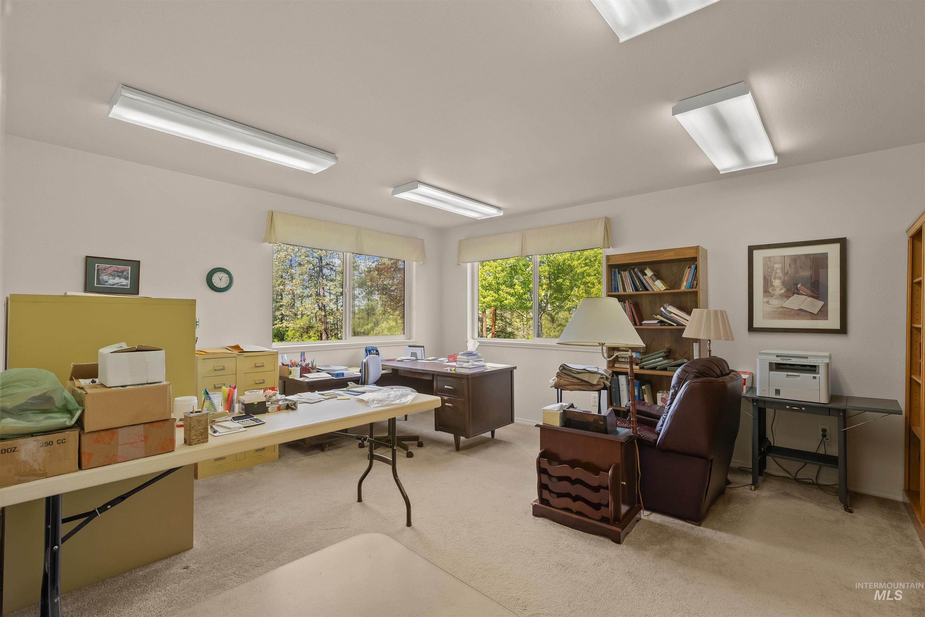 743 Wall Crk Road Stites, ID 83552 - Photo 33 of 48 Spacious room featuring multiple windows, recessed lighting fixtures, light-toned carpeting, and built-in shelving