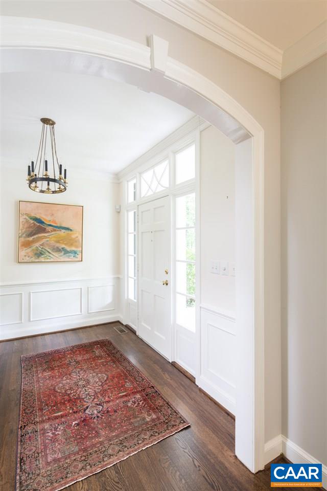 920 Windsor Road Charlottesville, VA 22901 - Photo 10 of 46 a view of an empty room with wooden floor and a window
