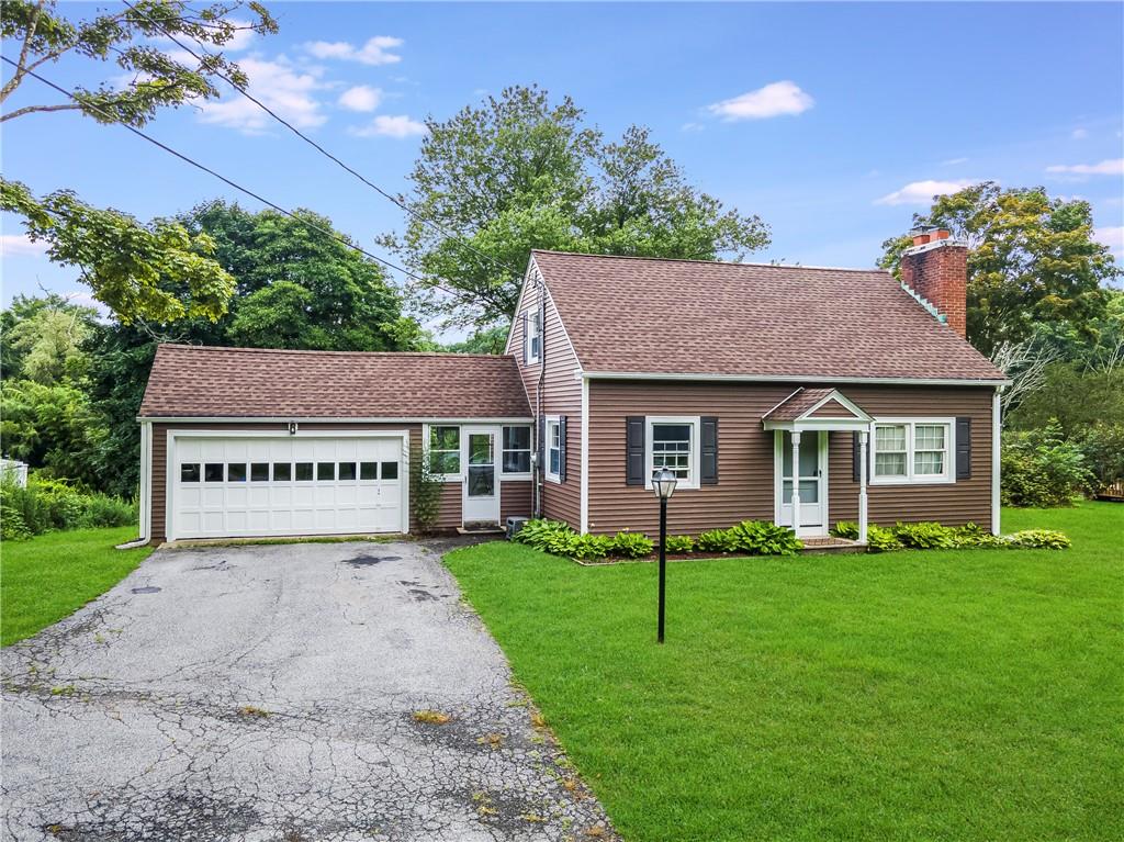 451 Smith Ridge Road South Salem, NY 10590 - Photo 1 of 1 View of front of house with a front yard and a garage