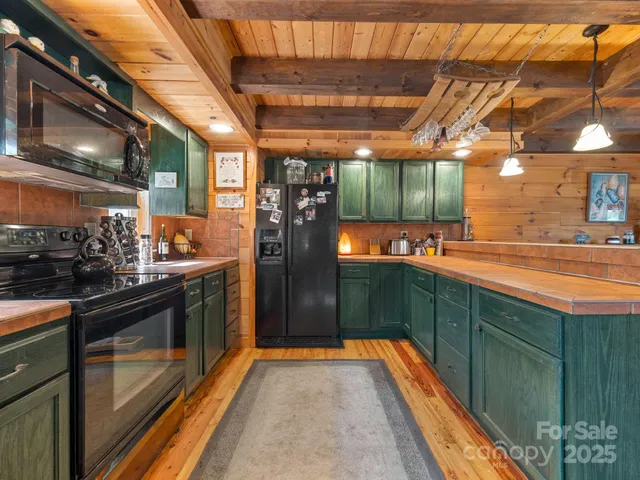 a kitchen with stainless steel appliances granite countertop a sink and cabinets