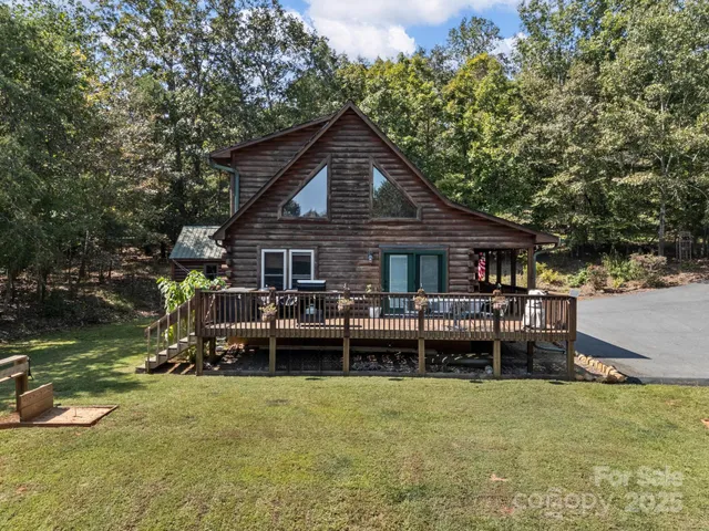 a front view of a house with a yard table and chairs