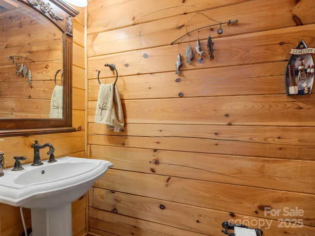 a bathroom with a sink and vanity