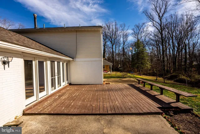 a view of swimming pool with trees in the background
