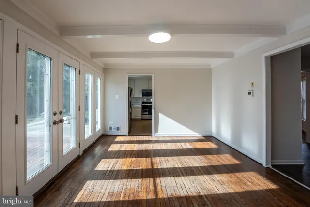 a view of an empty room with windows