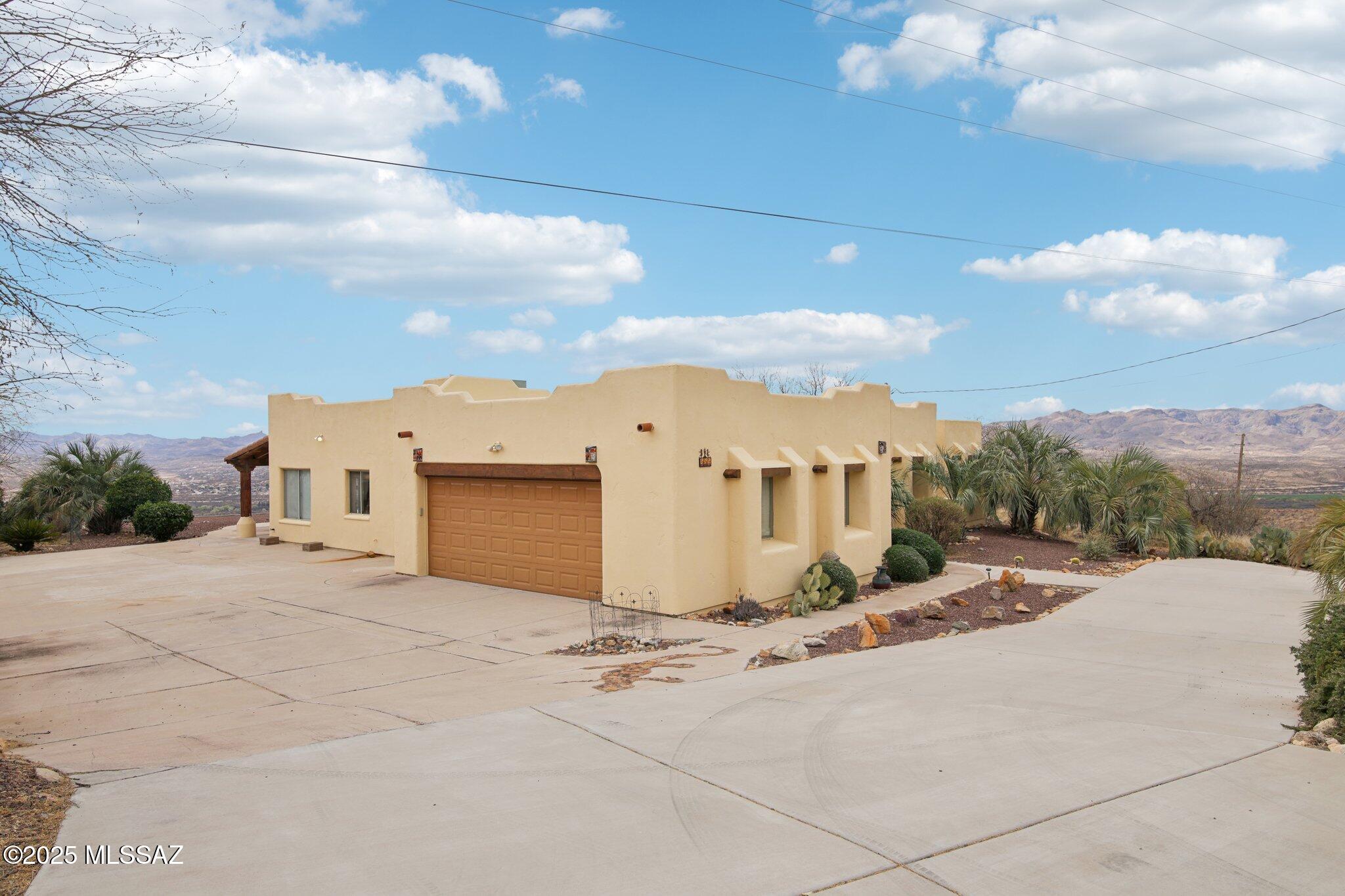 351 Camino Canoa Rio Rico, AZ 85648 - Photo 4 of 34 a view of a house with a yard