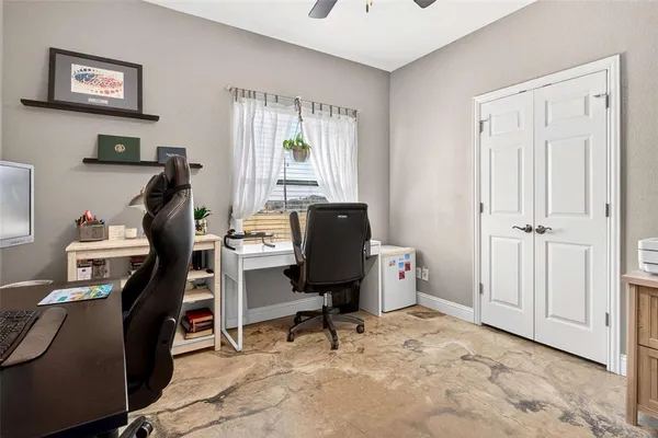 a view of workspace with windows recliner chair
