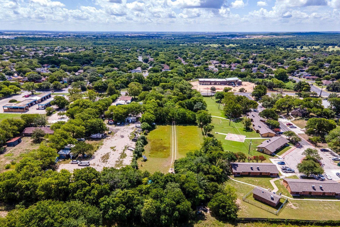 4904 Nuckols Crossing Road Austin, TX 78744 - Photo 8 of 10 an aerial view of residential houses with outdoor space and trees all around