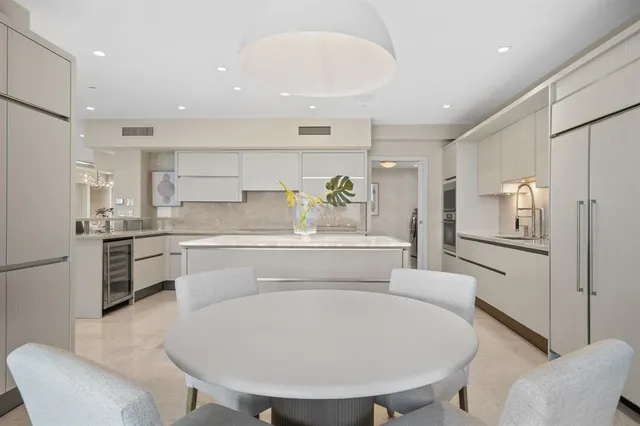 a bathroom with a granite countertop sink a shower and a mirror