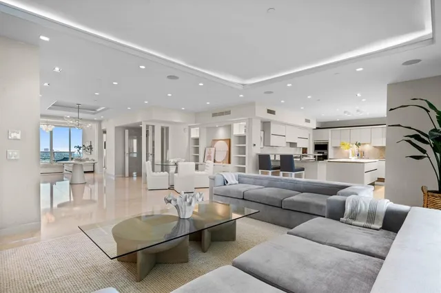 a kitchen with stainless steel appliances granite countertop a sink and a stove