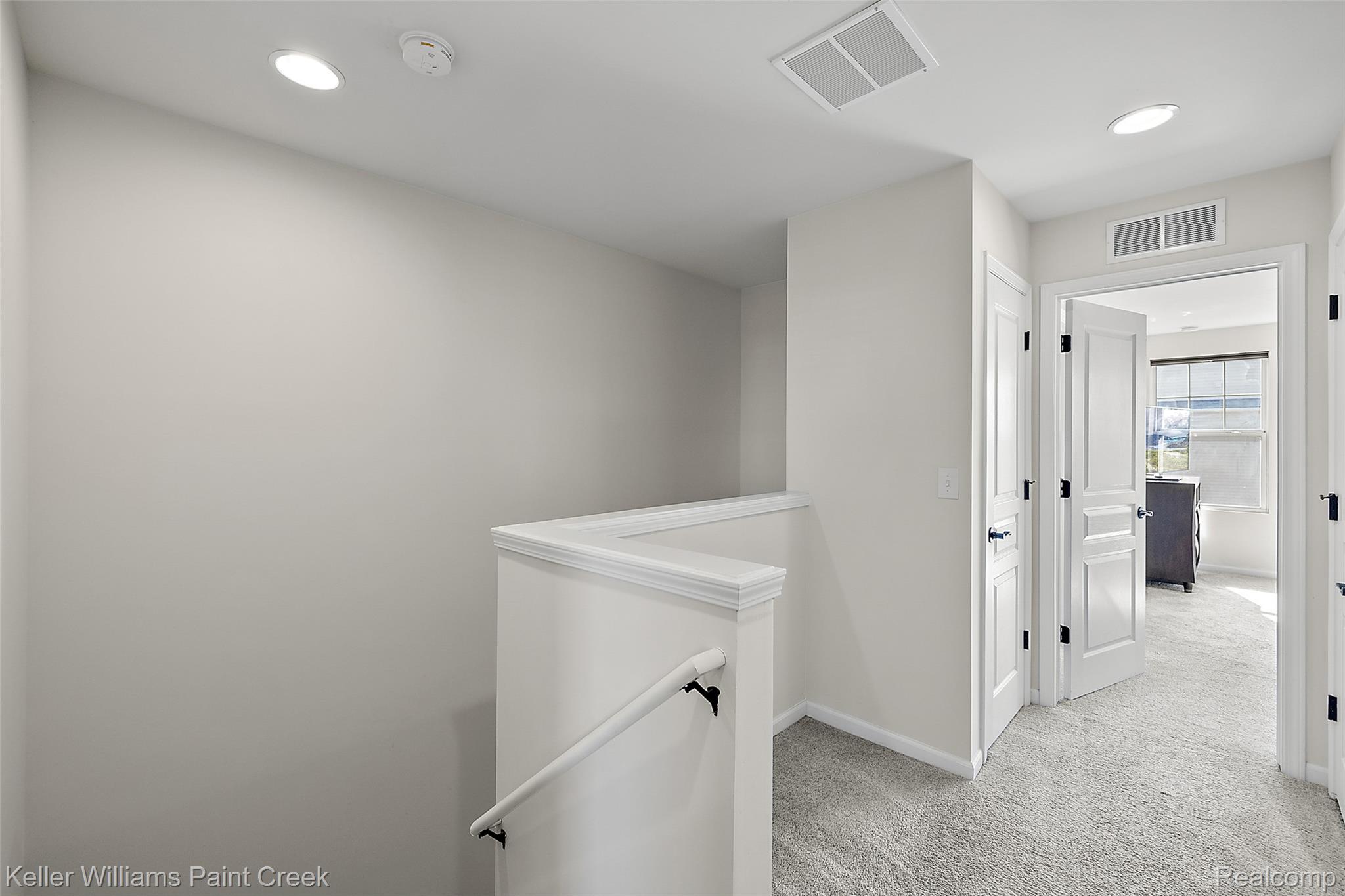 314 Glenhurst Boulevard Rochester, MI 48307 - Photo 21 of 64 Hall featuring light colored carpet, recessed lighting, and an upstairs landing