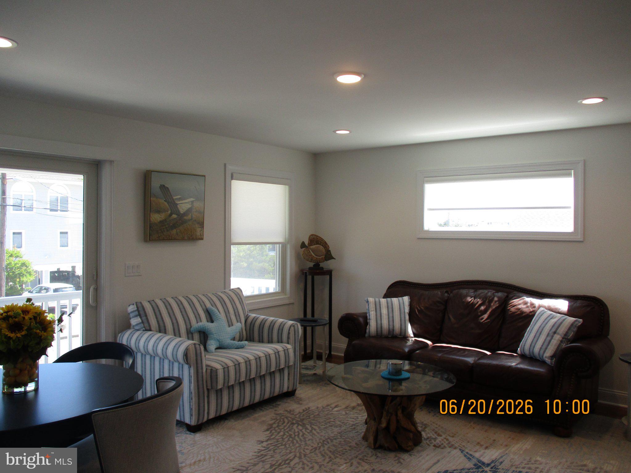 24 West 53rd Street Long Beach Township, NJ 08008 - Photo 57 of 75 a living room with furniture a rug and a window