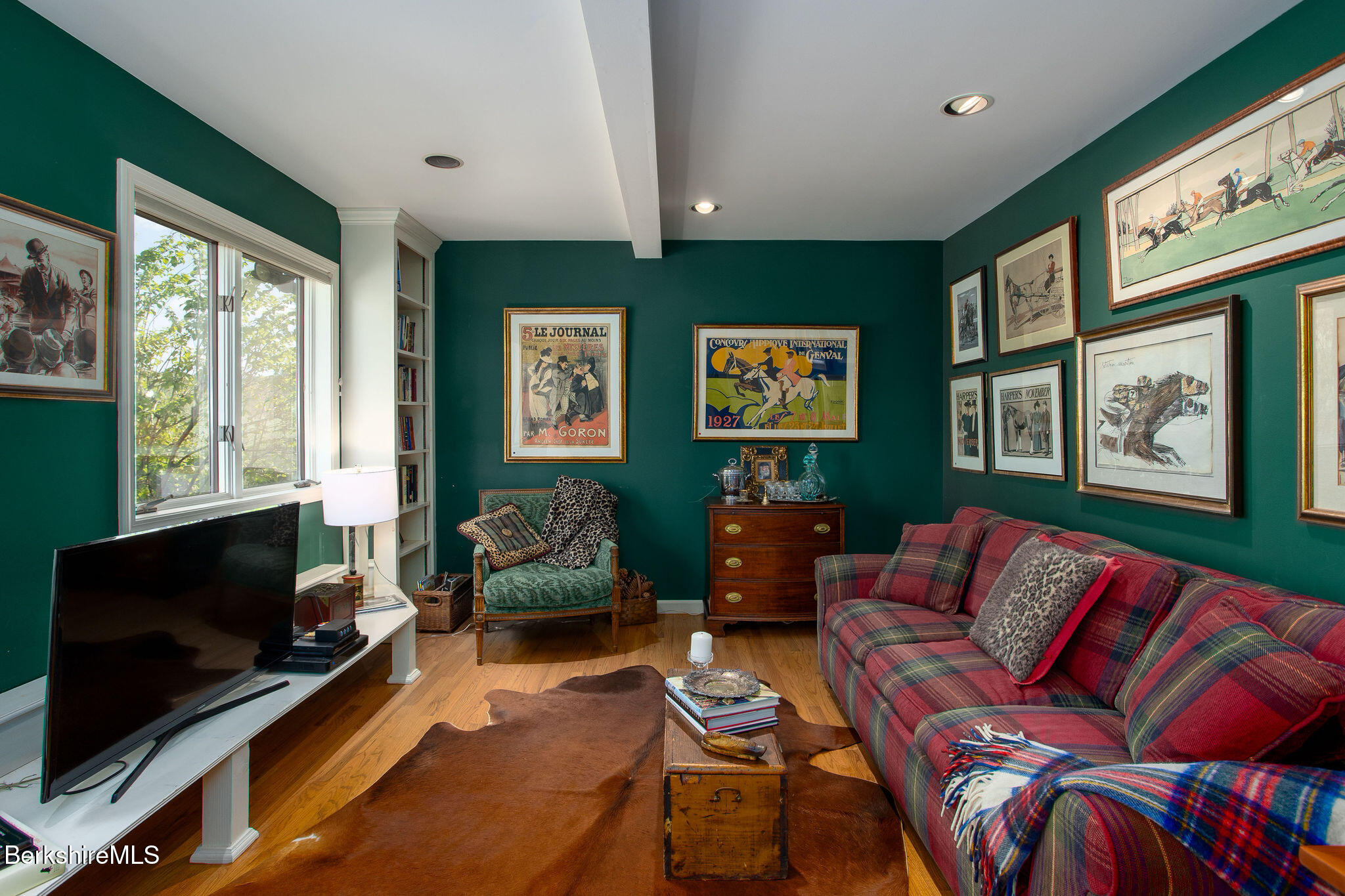 77 Hurlburt Road Great Barrington, MA 01230 - Photo 11 of 48 a living room with furniture a flat screen tv and a fireplace
