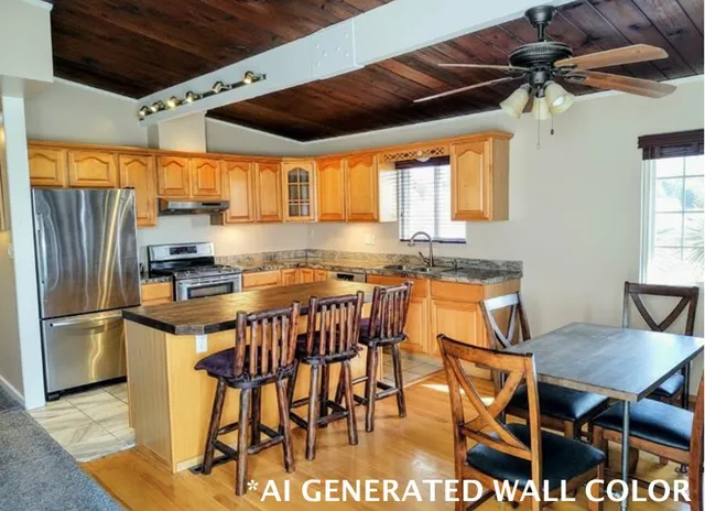 a kitchen with stainless steel appliances granite countertop a stove top oven a sink and a refrigerator