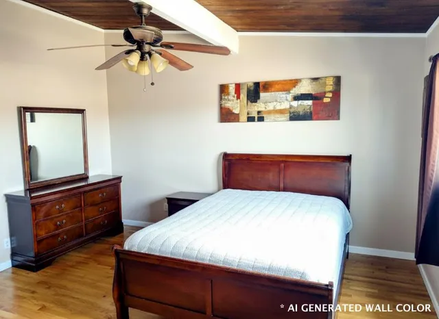 a bedroom with a bed and a dresser